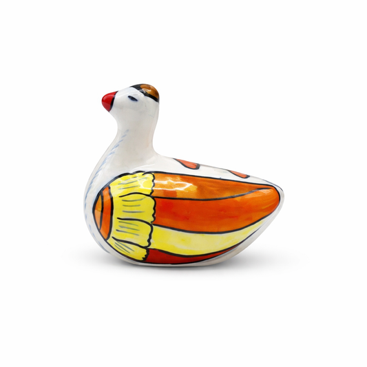 Ceramic duck figurine with colorful pattern on a white background