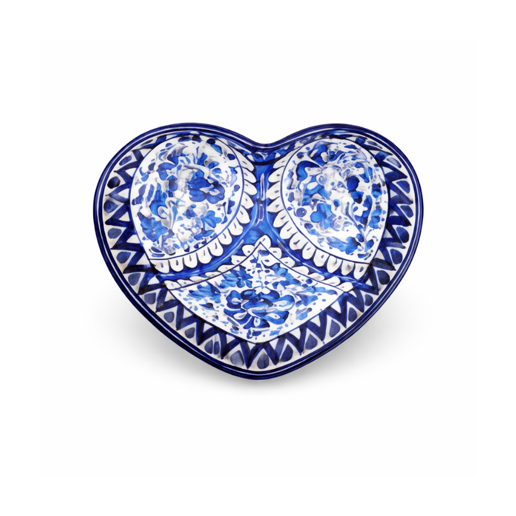 Heart-shaped ceramic dish with blue and white pattern on a white background