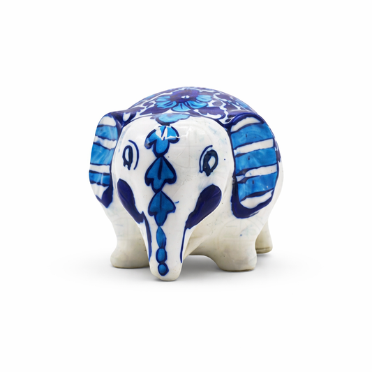 Ceramic elephant figurine with blue floral patterns on a white background
