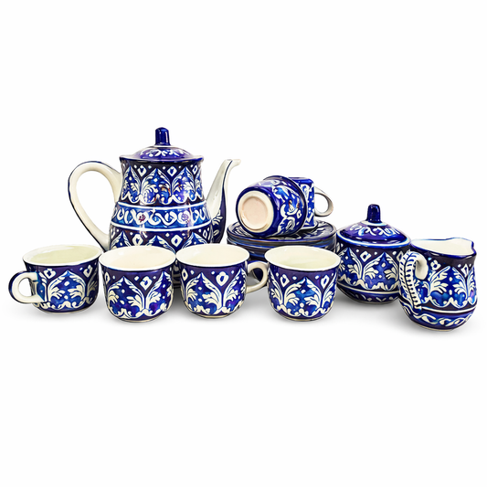 Ceramic tea set with blue and white floral patterns on a white background